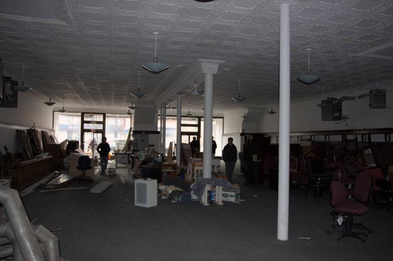 dark and outdated open concept office in cohoes