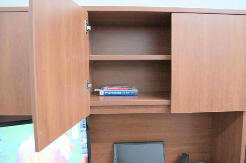 c sharp and linux books in desk cabinet