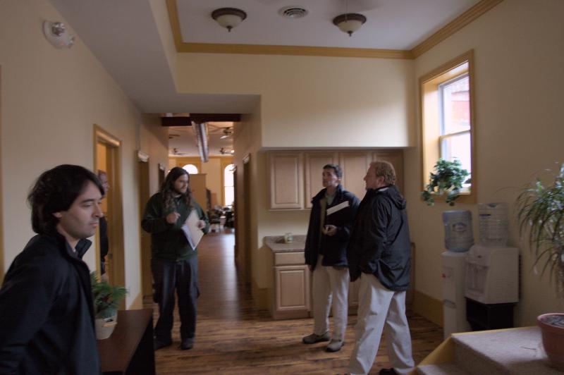 chris and nick talk with realtors in potential office location