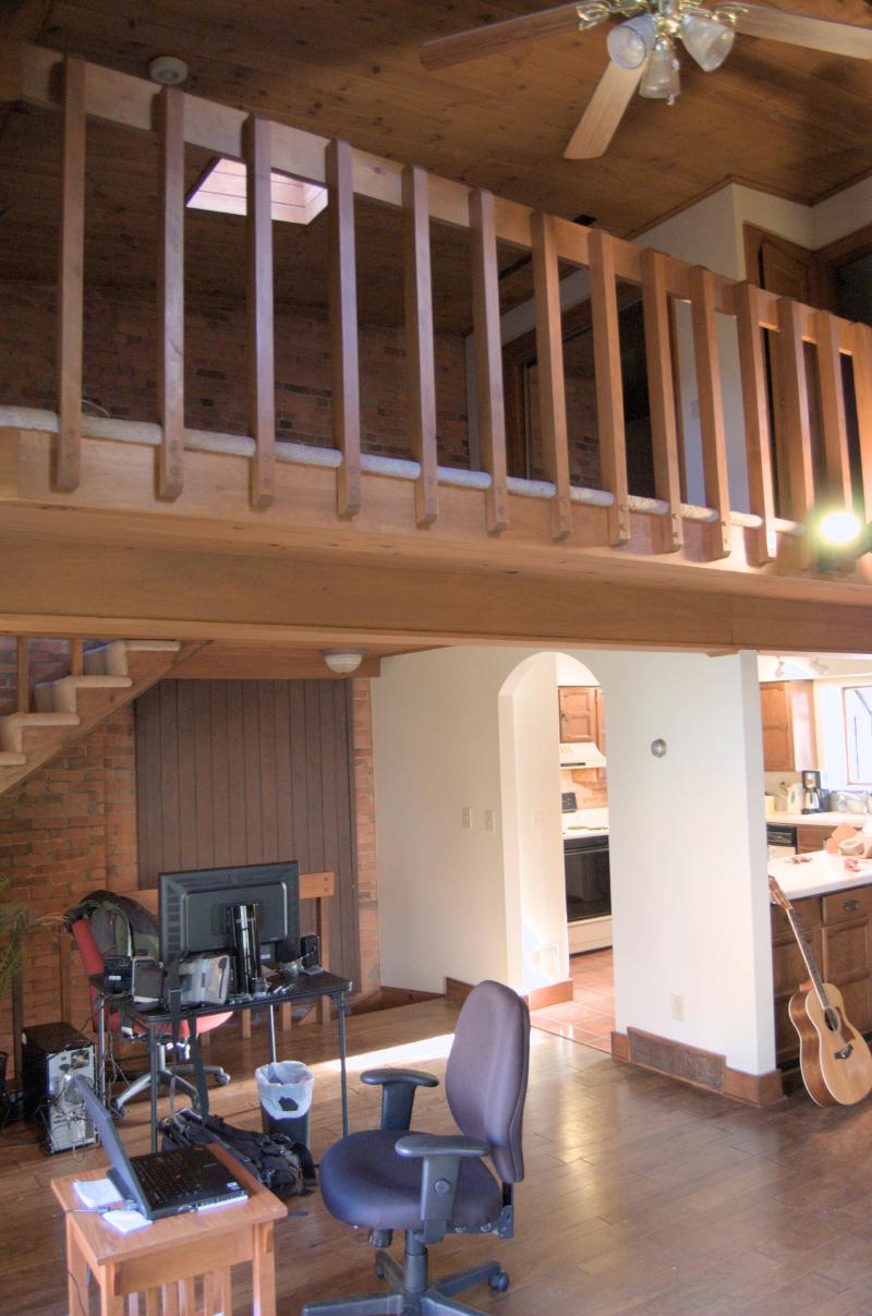 willett house loft, desk and kitchen in background